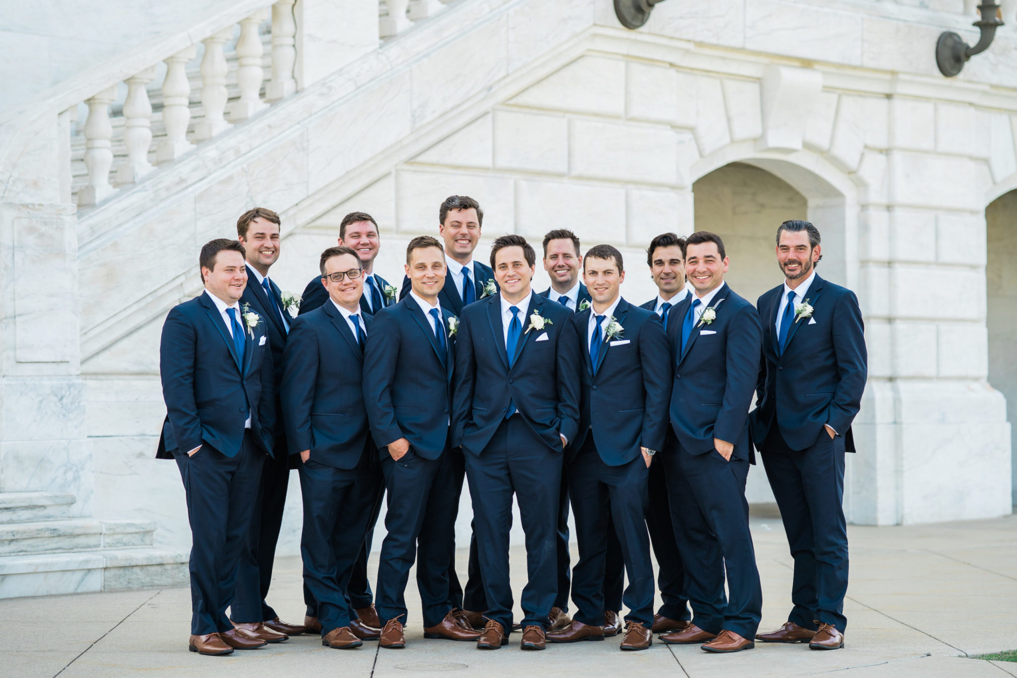 a collaged image of a groom with his groomsmen in front of the detroit institute of arts in downtown detroit