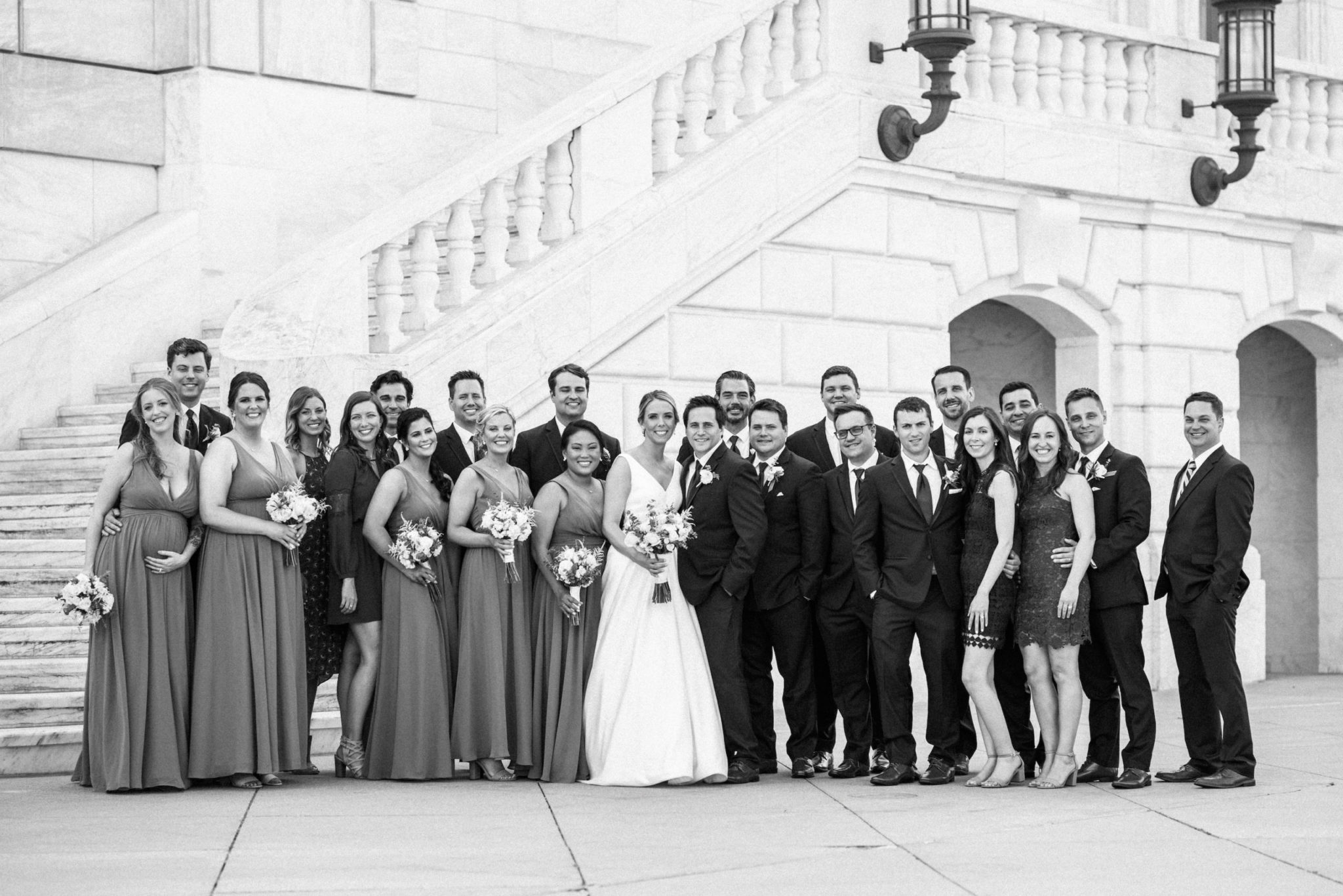 a wedding party in front of the detroit institute of arts