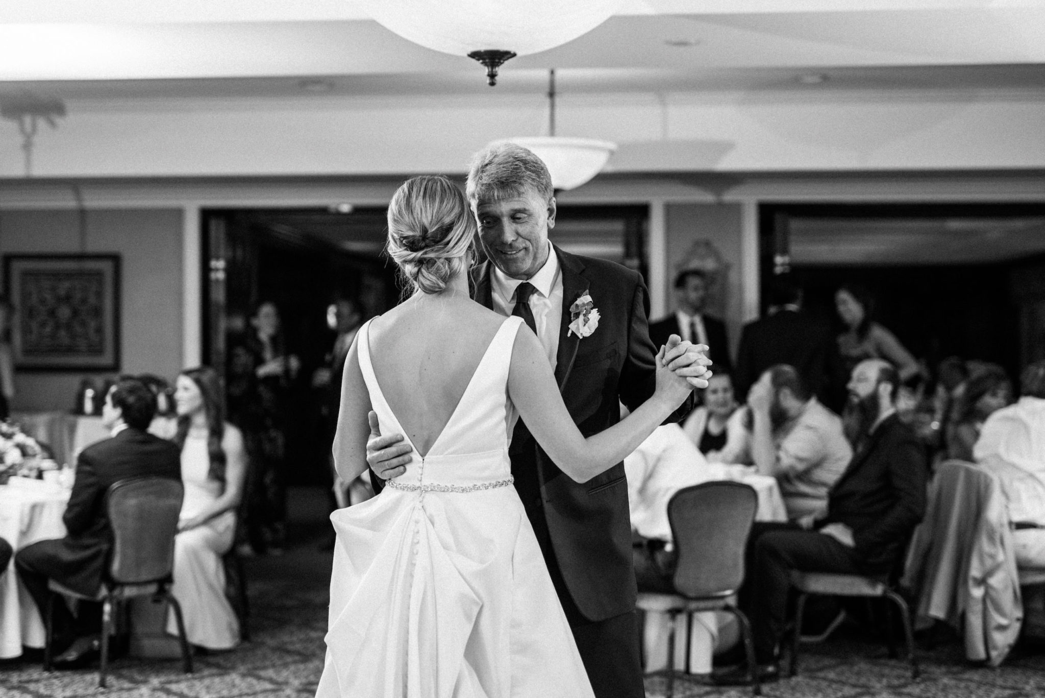 a bride dancing with her dad at a wedding at red run golf course in royal oak michigan