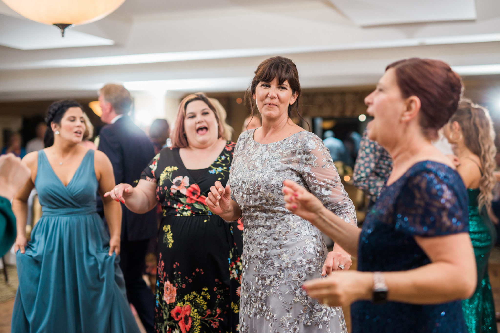 an image of wedding guests on the dance floor during a wedding at red run golf course in royal oak michigan