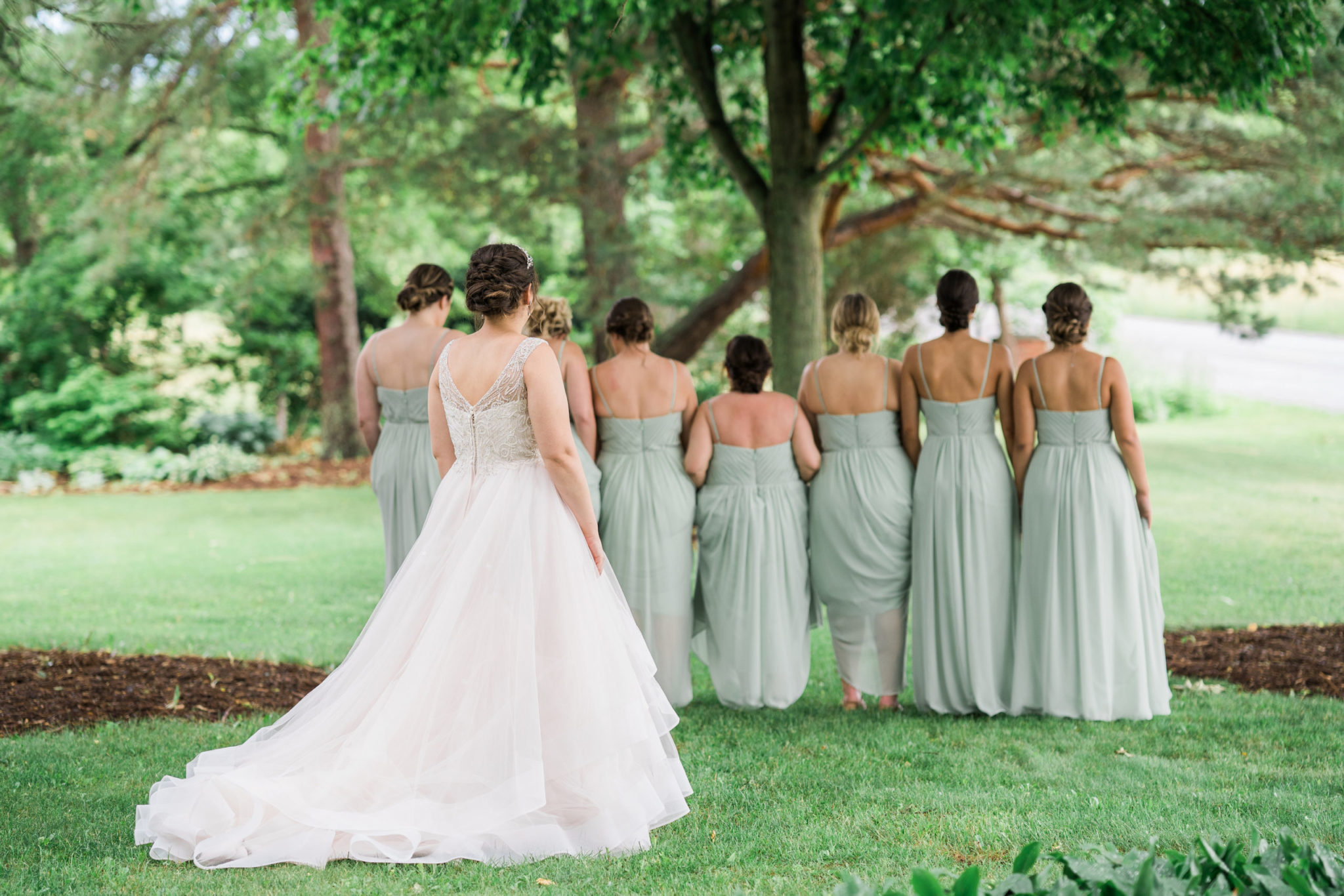 bride first look with her bridesmaids on her summer wedding day
