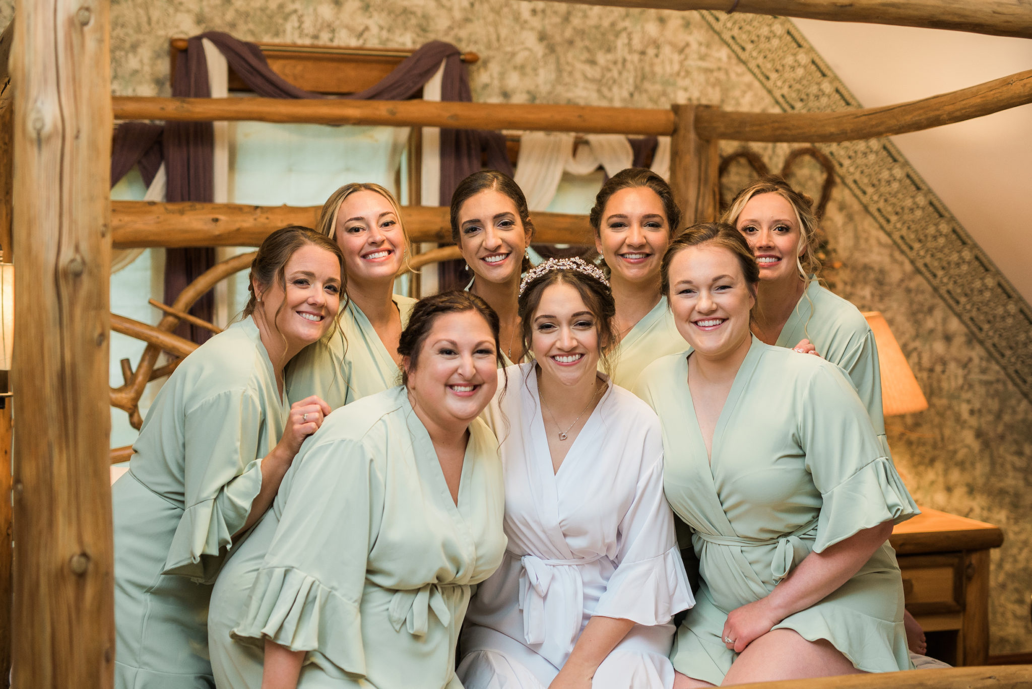 bride and bridesmaids in matching robes at the willowicke inn in williamston michigan