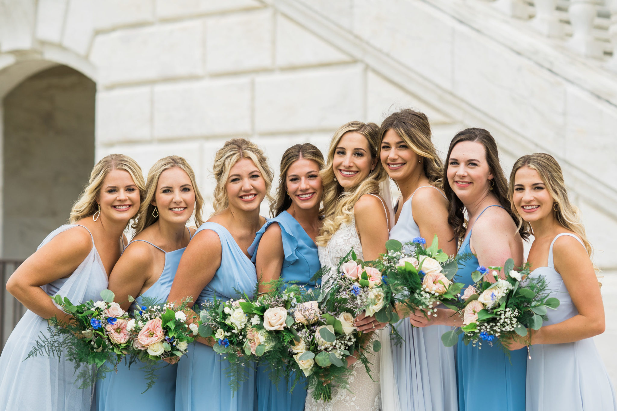 bridesmaids holding flowers on their downtown detroit wedding event