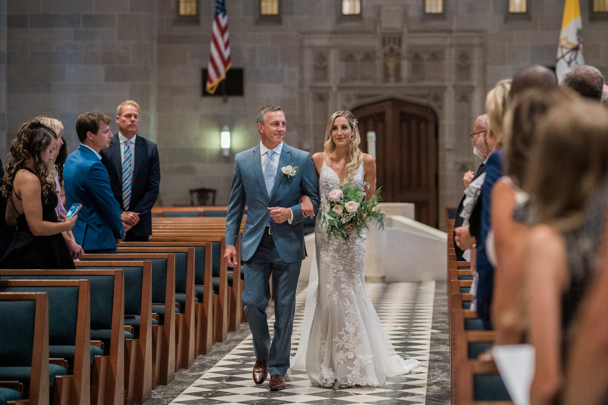 a bride walking down the aisle in a cathedral in downtown detroit michigan