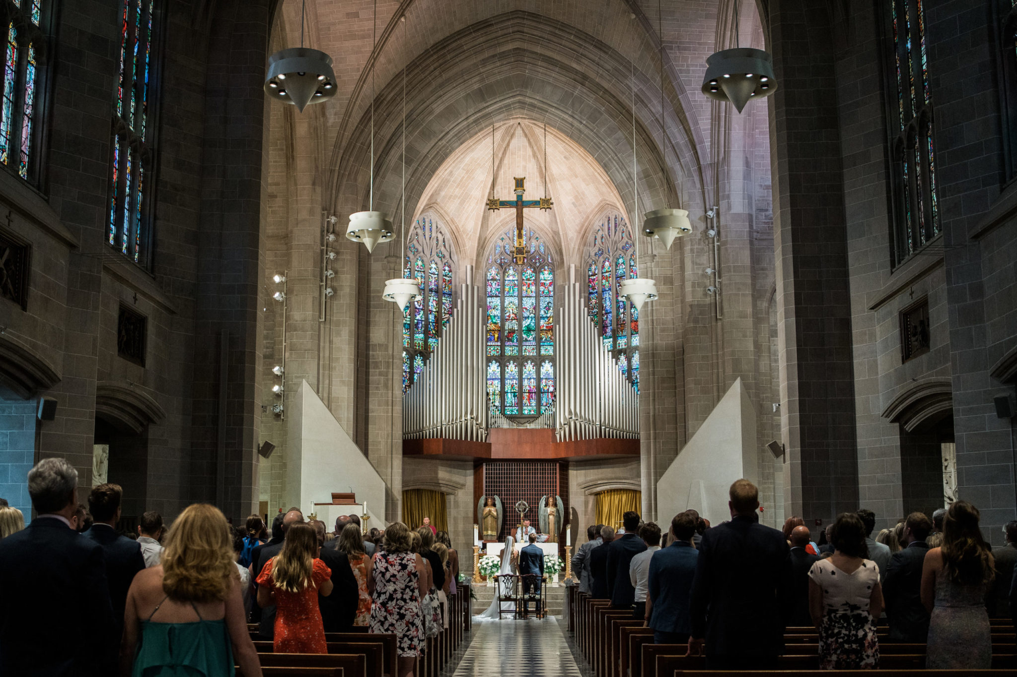 a classic downtown detroit wedding ceremony in a cathedral